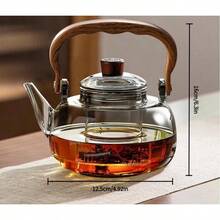 Bộ ấm trà chiều kiểu Anh, dung tích 1000ml, làm bằng thủy tinh borosilicate dày dặn, có lưới lọc trà và tay cầm bằng gỗ hồng mộc. Có thể tái sử dụng làm ấm trà, ấm cà phê hoặc ấm đựng đồ uống, phù hợp với bếp từ, lý tưởng cho gia đình, nhà hàng và các buổi tụ họp. - Nhiều màu - Xem 8