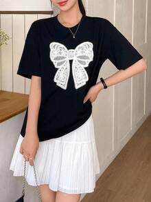 Camiseta de verano para mujer, holgada, informal, con estampado de lazo, cuello redondo y hombros caídos - Estilo vintage urbano, unisex, de algodón, manga corta, cuello redondo, ropa deportiva estilo Y2K, cuello redondo, 100% algodón, tejido suave, manga corta. 1 camiseta - Negro - Ver 6