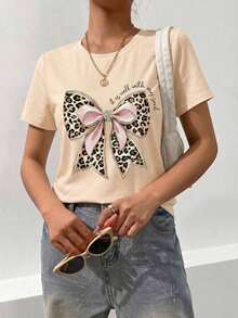 Nueva camiseta de manga corta con cuello redondo para mujeres, diseño primavera-verano, combina perfectamente un nudo de mariposa moderno y minimalista con estampados de letras en inglés, transpirable y absorbe la sudoración. Envío directo desde nuestro almacén local, modelo para parejas, ideal para llevar en pareja.-Vintage Street Style Unisexoose Cotton Short Sleeve Crew Neck T-Shirt - Albaricoque - Ver 4