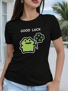 Manga Corta para Mujer Corte Regular - Dibujo Geométrico 2D Lindo Diseño de Rana con Trébol Estampado Camiseta Casual de Manga Corta con Cuello Redondo Versátil para Todas las Estaciones Múltiples Colores y Tamaños Disponibles Moda Festiva Estética Retro Material Transpirable Estampado Divertido - Negro - Ver 1