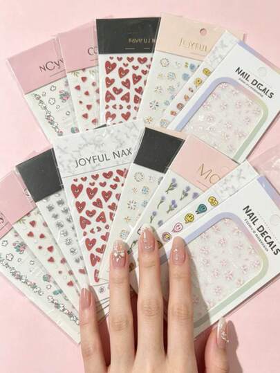 15pcs Nail Art Stickers Assortment! Includes Pink Sakura, Sweetheart Hearts, And Fun Doodle Designs, With 3D Textured Effects. Easy To Apply For Soft, Youthful Nails, Even For Beginners. Instantly Elevates Your Nails With A Sweet, Instagrammable Look.