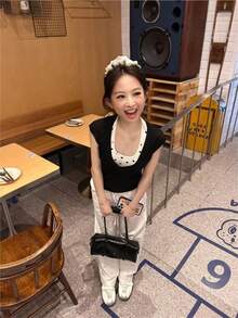 レディース トップス カットソー Tシャツ 半袖 フレンチスリーブ ホルターネック風 ドット柄 水玉 重ね着風 レイヤード アンサンブル風 バイカラー 切り替え ドッキング デザイン 着痩せ 細見え 体型カバー 二の腕カバー 骨格ウェーブ 骨格ストレート スリム フィット ストレッチ 大人可愛い きれいめ フェミニン ガーリー カジュアル レトロ デート お出かけ 通勤 通学 オフィスカジュアル 女子会 ママコーデ 20代 30代 40代 春 夏 秋 シワになりにくい 柔らかい 伸縮性 通気性 ブラック ホワイト モノトーン - ブラック - チェックする 1