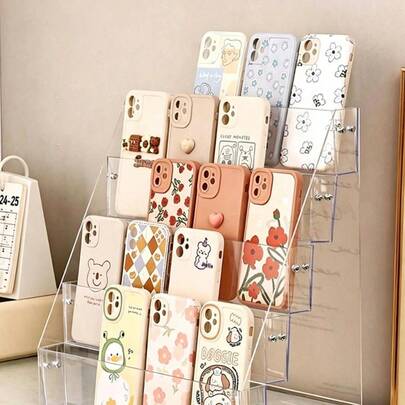 1 chiếc giá đựng điện thoại để bàn bằng acrylic trong suốt, giá đựng điện thoại nhiều tầng bằng acrylic trong suốt để bàn.