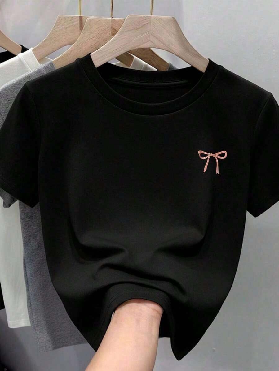 Free Shipping, Local Delivery In Mexico, Delivery In 4 Days. Women's T-Shirt Made Of 100% Cotton, Soft And Comfortable, With Short Sleeves And A Round Neck, Featuring A Small Pink Bow Print. - 黑色 - 查看 1