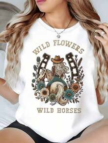 Imagen de una vaquera montando un caballo rodeada de herraduras y flores silvestres que simbolizan libertad y fuerza interior camiseta de mujer 100% algodón cómoda y moderna,Camiseta Gráfica Vintage Oversized Mujer Algodón - Blanco - Ver 1