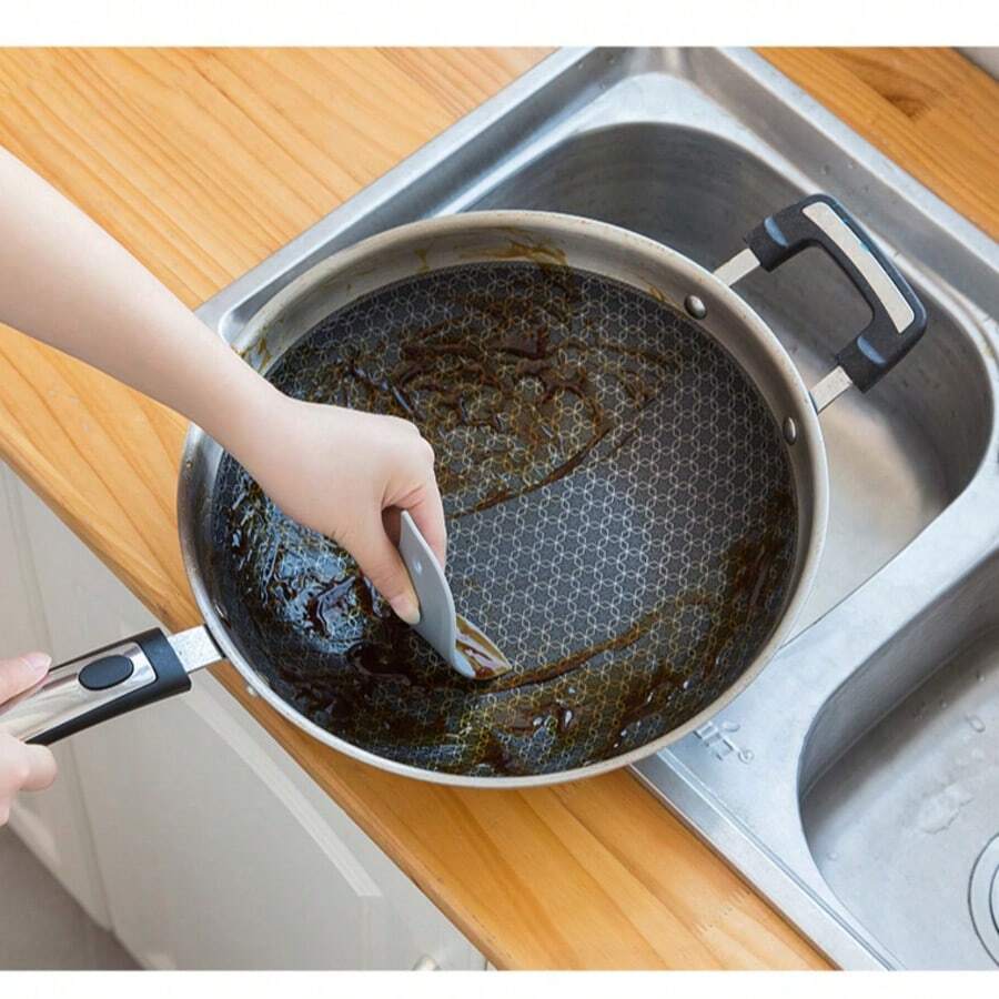 1 cái dụng cụ cạo hình chim cánh cụt dẻo, dụng cụ nhà bếp gia dụng loại bỏ vết dầu mỡ, thích hợp để cạo sạch dầu mỡ và bụi bẩn.