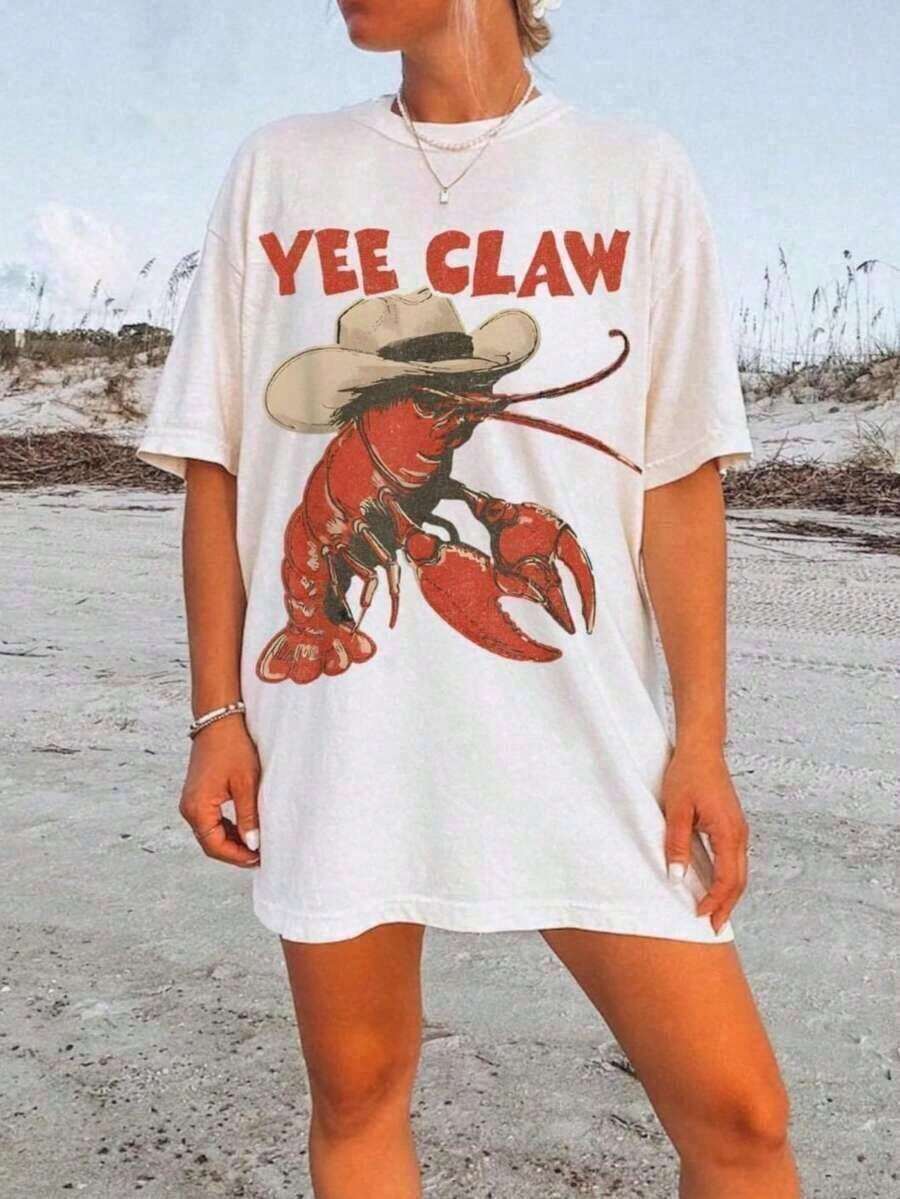 Nueva llegada 2026 Tops2026 Camiseta de Vaquero con Langosta, Camiseta Divertida con Garra de Langosta, Camiseta de Playa Estilo Western, Camiseta de Verano para Viaje a la de Amalfi, Camiseta de Manga Corta Casual de Talla Grande para Mujer, Camiseta Holgada con Estampados de Moda 100% Algodón para Todas las Temporadas, Regalo para Amigas y Familiares en Fiestas, Vacaciones, Acción de Gracias, Halloween, Día de San Valentín, Camisetas Gráficas Unisex, Ropa de Verano para Mujer, Tela Suave, Transpirable, Moda, Camiseta de Mujer 100% Algodón para Uso Diario con Estampado Gráfico. - Blanco - Ver 1