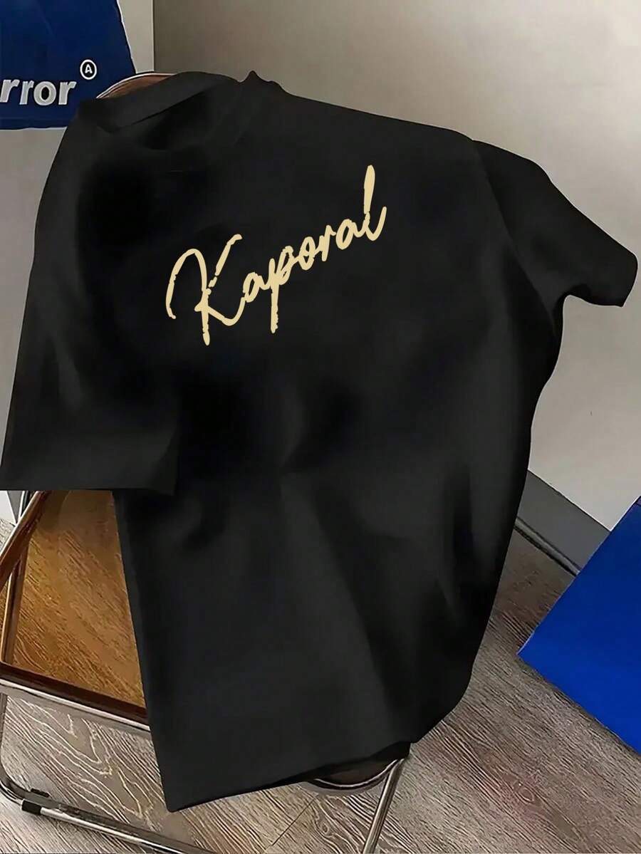 Kaporal Men's French-Casual Style T-Shirt With Cursive Logo - Summer Short-Sleeved Round Neck Loose Fit T-Shirt, French Style Clothing Suitable For Everyday And Year-Round Wear, Machine Washable Casual T-Shirt, Loose And Comfortable For Summer. - Black - View 1