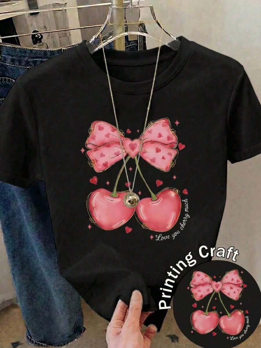 Camiseta Casual de  de Cuello Redondo y Manga Corta con Estampado de Cerezas y Lazos, de Longitud Regular, en Tela de Poliéster Ligeramente Elástica |   Diseño exquisito |   Suelto y cómodo |   Fácil de combinar | - Negro - Ver 1