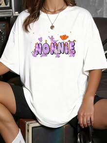 Colorful Design With Large Lettering Decorated With Purple Cartoon Characters That Convey Joy And Youthful Energy. Casual Women's T-Shirt With A Fun Print And Urban Touch. - 白色 - 查看 6