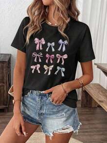 Camiseta suave 100% algodón, informal para mujer, de cuello redondo y manga corta, con un encantador estampado de lazo, corte regular, transpirable, combina con todo, fresca y moderna. - Negro - Ver 2