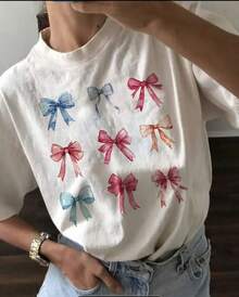 Ropa de mujer para verano y primavera, top casual de manga corta con cuello redondo, camiseta con estampado de lazo. - Negro - Ver 9