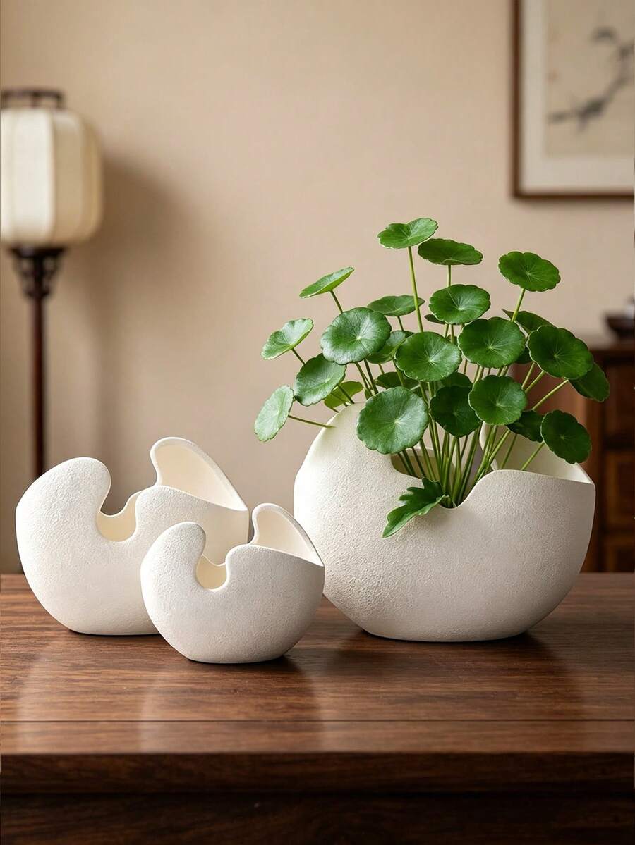 这款纹理树脂花瓶/花盆造型独特,不对称设计,非常适合在咖啡桌、书桌或窗台上摆放小型植物或树枝。它是为现代生活空间和办公室增添简约自然气息的理想之选。 - 彩色 - 查看 1