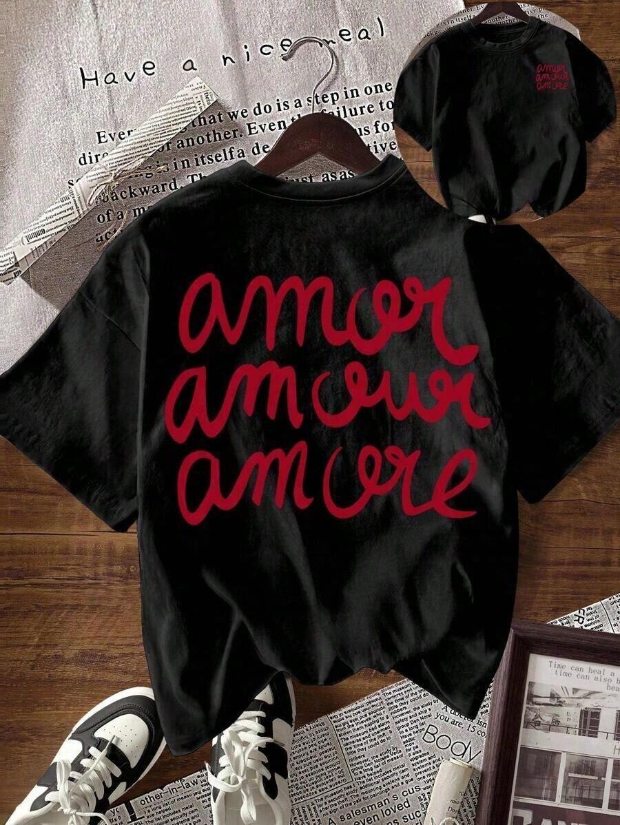 Diseño de doble cara en la parte delantera y trasera, sencillo y versátil, camiseta de algodón estampada de manga corta y cuello redondo, corte holgado e informal para mujer. - Negro - Ver 1