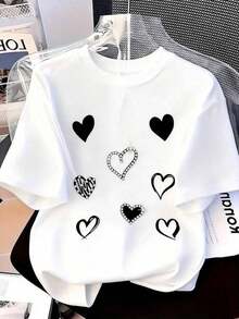2026 Estampado de camisas de mujer,Nuevo verano ligero blusas casuales para dama,Camiseta del Día de San Valentín [Camiseta de mujer talla plus] Camiseta para mujer talla plus con diseño de corazón rojo y moño negro Manga corta, cuello redondo, tejido con mediana elasticidad, ajuste para todas las temporadas - Blanco - Ver 1