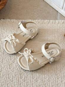 1 đôi sandal ren nơ màu trắng kem cho bé gái, thiết kế hở mũi, một quai với khóa điều chỉnh, đế bằng mềm mại, chống trơn trượt, thích hợp cho mùa xuân/hè đi biển, phong cách thường ngày, công chúa. - trắng - Xem 2