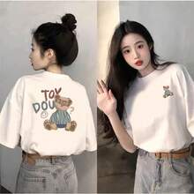 Camiseta blanca de manga corta y cuello redondo con estampados de dibujos animados en la parte delantera y trasera, corte holgado, nuevo estilo de verano 2025, top versátil para mujer. - Blanco - Ver 1
