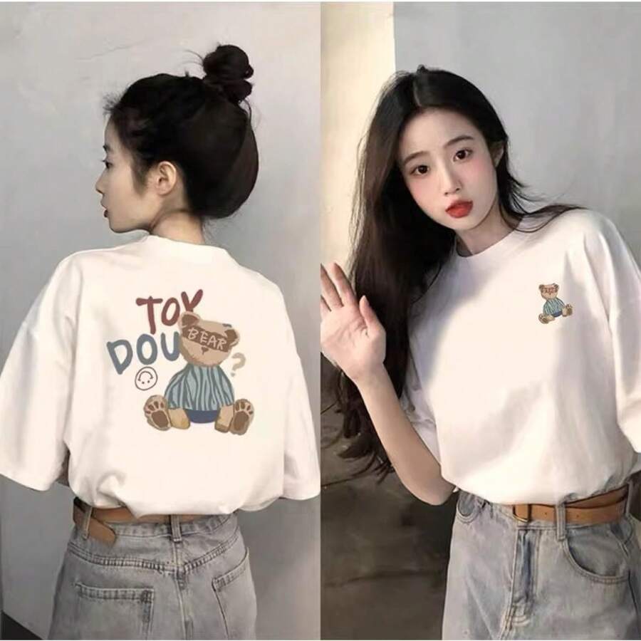 Camiseta blanca de manga corta y cuello redondo con estampados de dibujos animados en la parte delantera y trasera, corte holgado, nuevo estilo de verano 2025, top versátil para mujer. - Blanco - Ver 1