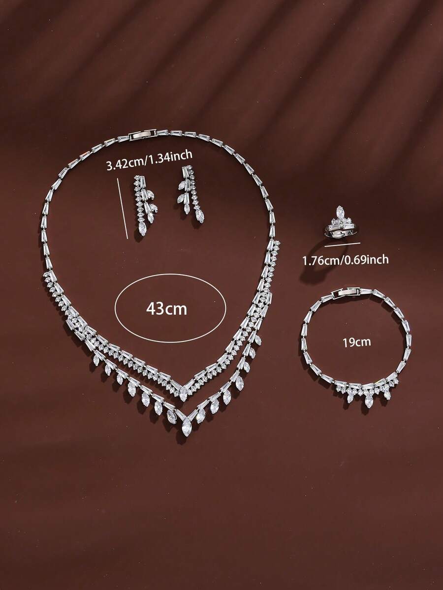 1 set de bijoux avec pendentif en zircone en forme de V, collier, boucles d'oreilles, bracelet, bague 4 pièces - Ensemble boucles d'oreilles, collier, bague et bracelet - Voir 1