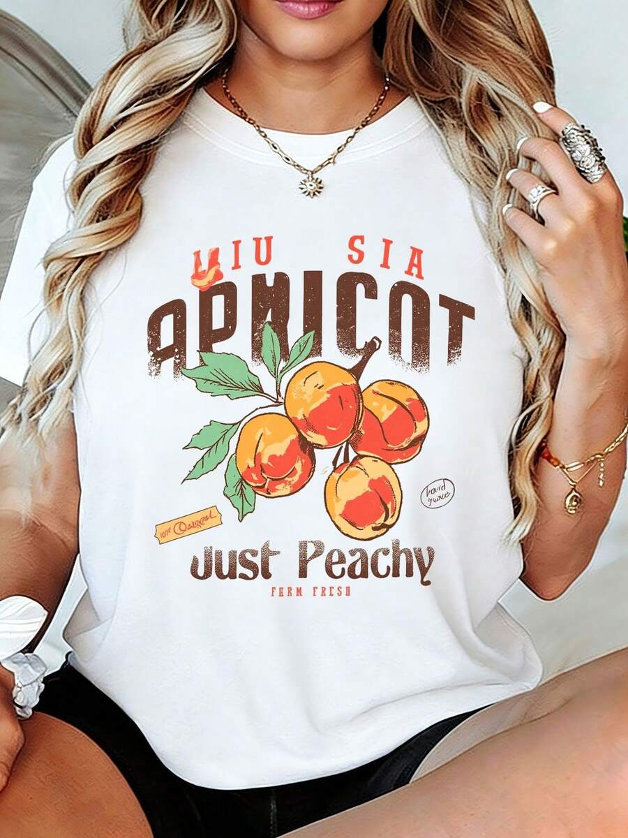 Camiseta con estampado gráfico de albaricoque de estilo vintage - Camiseta de cuello redondo Miu Sia Farm Fresh Just Peachy para mujer, Top suave de verano con diseño de fruta desgast, Camisa de moda casual perfectara llaya, las vacaciones y el uso diario