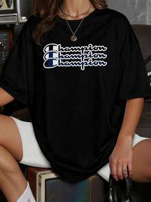 Texto con palabra champion" repetida en estilo deportivo que simboliza fuerza y superación personal camiseta para mujer cómoda y casual perfecta para uso diario - Negro - Ver 1