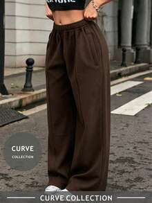 Pantalones anchos y sueltos de talla grande para mujer en color marrón, con cintura elástica y bolsillos. Cómodos y versátiles para la oficina, el fin de semana y las vacaciones - Marrón Chocolate - Ver 1