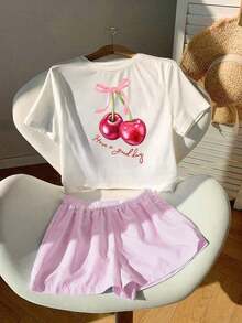Una camiseta de manga corta para mujer con estilo retro americano, de corte holgado y con diseño estampado (los pantalones son solo para sugerencias de estilo). Esta pieza sencilla y elegante presenta un patrón de letras impresas con temática tropical, lo que la convierte en un elemento imprescindible para crear un look relajado de vacaciones, perfecto para ocasiones como el Día del Trabajo y el Día de la Independencia de México. - Blanco - Ver 2