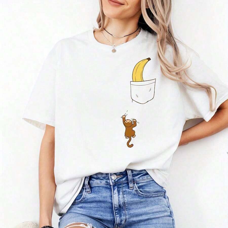 Camiseta con diseño de plátano y mono escalando hacia el bolsillo, diseño de animales divertido con una ilustración de humor ingenioso, estilo juguetón, camiseta de cuello redondo unisex. |   Diseño exquisito |   Suelto y cómodo |   Fácil de combinar | - Blanco - Ver 1
