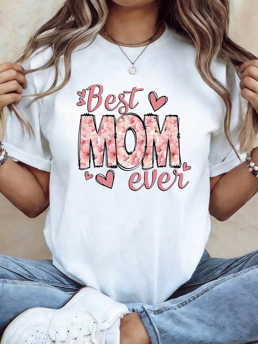 Camiseta de tela suave, estilo dulce y acogedor, con estampado de flores rosas, la palabra "MOM" y "La mejor mamá del mundo", camiseta de talla grande para mujer, adecuada para el Día de la Madre, reuniones familiares, actividades entre padres e hijos y uso diario casual, camiseta de moda de manga corta. - Blanco - Ver 1