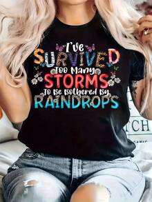 Camiseta Casual Wo - "He Sobrevivido a Demasiados Tempestades para Preocuparme por las Gotas de Lluvia" |     Cuello Redondo, Manga Corta, Tejido Ligeramente Elástico, Top Cómodo para Todas las Estaciones, Estilo Casual, Top para todas las estaciones |     Camiseta con Cita Divertida |     Tejido Elástico - Negro - Ver 2