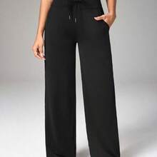 Dewbera Pantalones deportivos y de yoga para mujer con estampado de letras y cintura cruzada - Gris - Ver 2