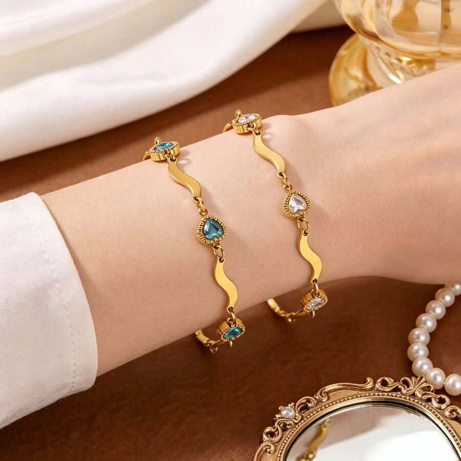 1 chiếc vòng tay nữ thời trang hình trái tim đính đá quý, thiết kế độc đáo, mạ vàng 18K, làm từ thép không gỉ, thích hợp đeo hàng ngày và làm quà tặng dự tiệc.