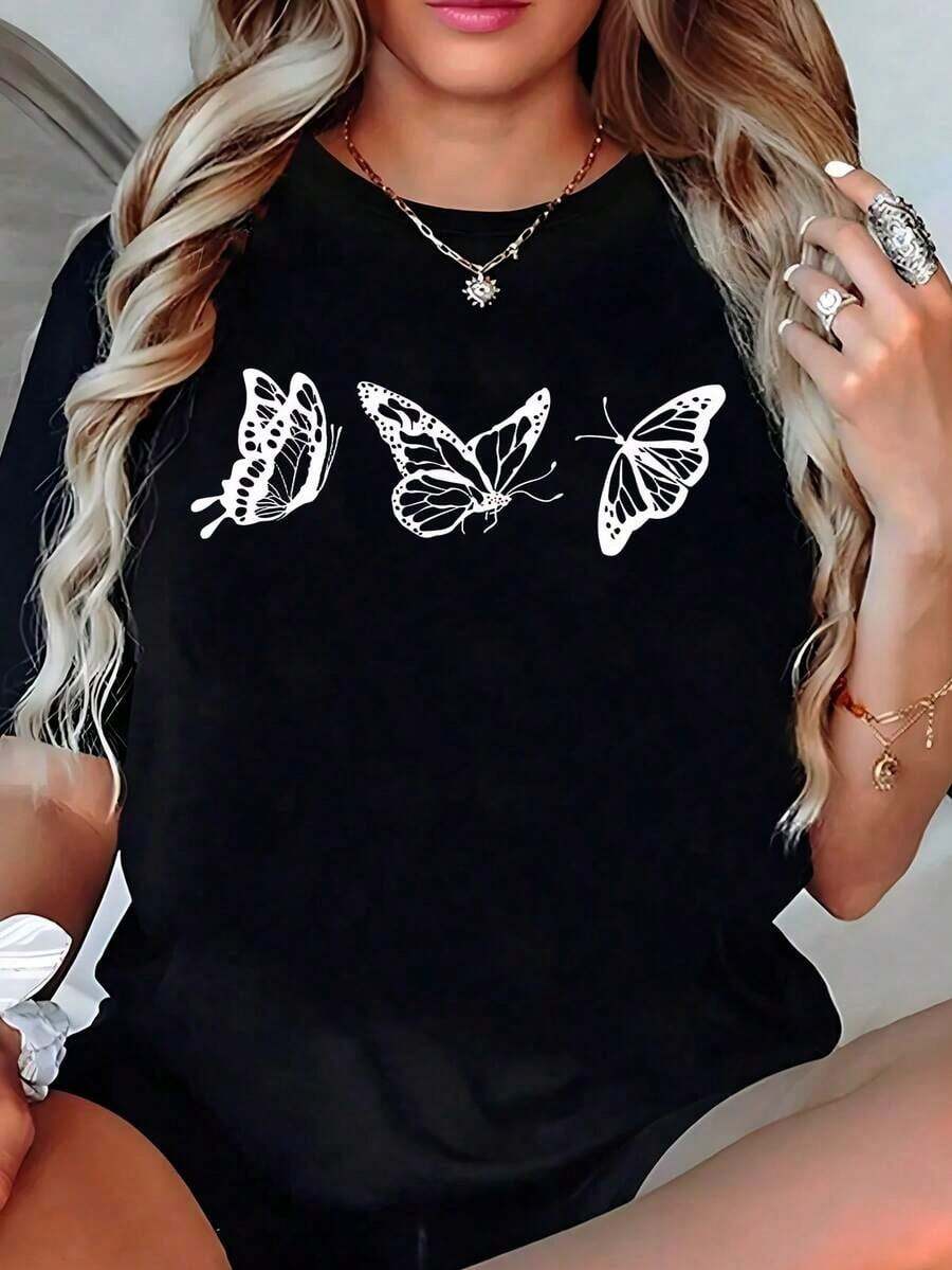 Playera Negra con Estampado de Mariposas Blancas, Camia Casual de Manga Corta Estilo Aesthetic, Blusa Holgada con Gráfico, Ropa de Mujer a la Moda Juvenil, Tops de Verano LindosAdecuado como regalo. playera de mujer. blusas>elegantes. boho chic,Exquisita camiseta estampada de cuello redondo para mujer, ideal para varias estaciones, perfecta para vacaciones, viajes y días festivos. - Negro - Ver 1