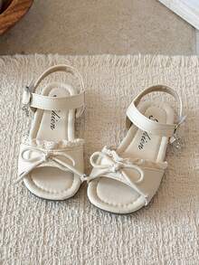 1 đôi sandal ren nơ màu trắng kem cho bé gái, thiết kế hở mũi, một quai với khóa điều chỉnh, đế bằng mềm mại, chống trơn trượt, thích hợp cho mùa xuân/hè đi biển, phong cách thường ngày, công chúa. - trắng - Xem 3