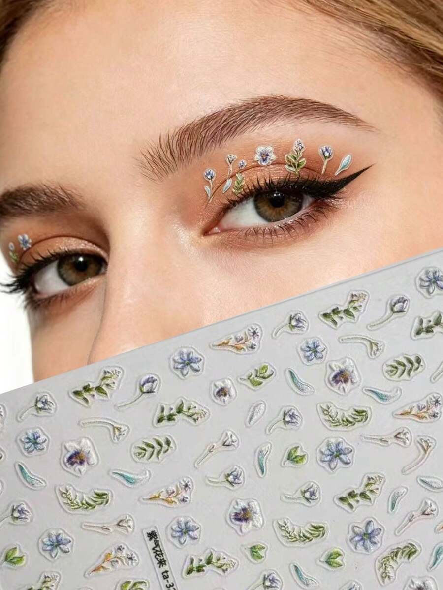 1 pièce Look de maquillage inspiré du printemps : ombre à paupières marron chaud, eye-liner noir précis, avec autocollants floraux violets en accent. Les fleurs violettes translucides sur la base de maquillage marron chaud évoquent une douce et vivante brise printanière. Y2K, paillettes pour le visage, carnaval, autocollants pour le visage, autocollants 3D, pierres décoratives pour le visage, autocollants décoratifs - Multicolore - Voir 1