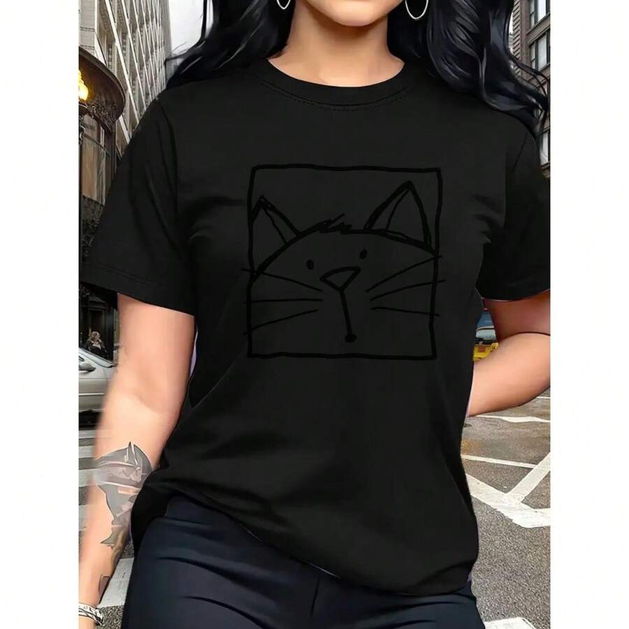 Camiseta de Mujer 100% Suave Rosa con Estampado de Cara de Gato Negro - Cuello Redondo Casual, Manga Corta, Top Rosa Pálido, Atuendo Minimalista Casual, Comodidad para Todas las Estaciones, Lavable a Máquina, Outfit para Amantes de los Gatos - [Negro] - Ver 1