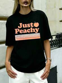 Camiseta de Talla Grande y Corte Holgado - Camiseta Casual con Estampado Gráfico "Just Peachy" con Diseño de Melocotón y Rayas Retro, Corte Relajado, Perfecta para Uso Diario, Ideal para Sal - Negro - Ver 1