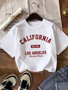 Camia Women's T-Shirt, Round Neck, Short Sleeve, Graphic Print, City Names, CALIFORNIA, Los Angeles, United States. Round Neck, Short Sleeve, Spring/Summer, Everyday Wear. Suitable As A Gift. Women's T-Shirt. Blouses > Elegant. Boho Chic. Women's T-Shirt, Soft And Breathable: Perfect For Vacations, Travel, And Festive Occasions, And Suitable For Wearing In Multiple Seasons. - 白色的 - 查看 9