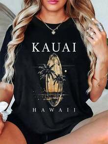 Camiseta de algodón vintage hawaiana para mujer - Camiseta gráfica de Kauai, Hawái, con estampado de tabla de surf, atardecer en un árbol y monumentos de Kauai, y top dorado casual de manga corta con cuello redondo para vacaciones en la playa, atuendos de estilo hawaiano, camiseta de algodón puro de alta calidad con estampado minimalista, tela suave y transpirable, cómoda y holgada, adecuada para usar todo el día, adecuada para ropa casual de oficina, apariencia diaria de primavera y verano, diseño elegante y juvenil. - Negro - Ver 1