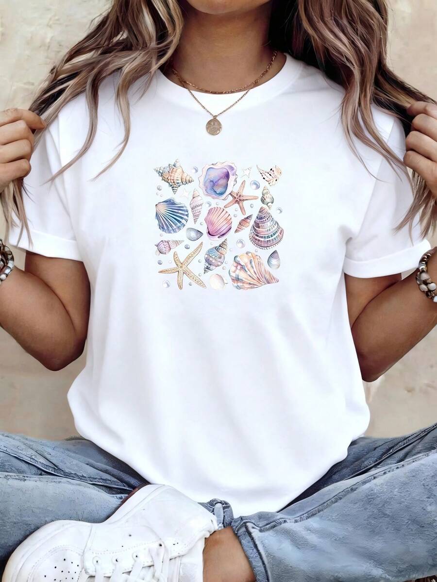 PremiumCamiseta de manga corta con cuello redondo para mujer, diseñada con estampados de conchas y estrellas de mar, es perfecta para un estilo casual. Cómoda y transpirable, es ideal para primavera y otoño, ofreciendo un aspecto relajado y elegante.Nueva llegada - Blanco - Ver 1
