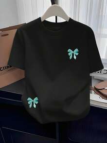 Camiseta Casual Versátil de Cuello Redondo para Mujer |   Nueva Camiseta de Manga Corta con Cuello Redondo, Estampada, Sencilla y Moderna, con Patrón de Lazo Bordado de Imitación, Cómoda, para Todas las Temporadas, Estilo Vintage Urbano, Unisex, de Algodón, Corte Holgado. - Negro - Ver 7