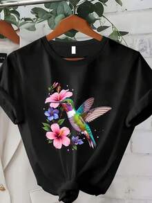 Talla Grande - Talla Grande - Camiseta de gran tamaño con colibrí y hibisco de la Sra. Treba - una camiseta negra y verde azulado con estampado de estilo hawaiano de manga corta y cuello redondo, perfectara ropa casual de playa de verano, conjuntos para el parque y atuendos para fiestas hawaianas (lavable a máquina) - Negro - Ver 2