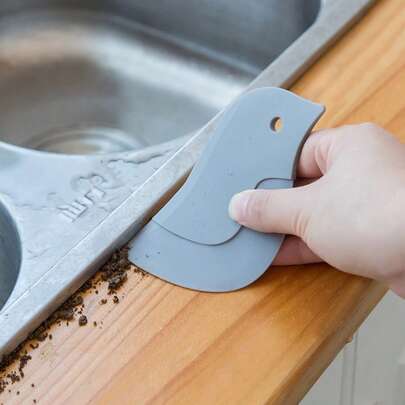 Raspador de tabla de aceite, tipo suave de pingüino, raspador de manchas de aceite de cocina doméstica, herramienta pequeña de cocina para hornear