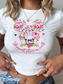 Authentic Disney: Featuring A Brand-New Print Design Of Mickey And Minnie Mouse Standing Before A Uniquely Designed Floral Castle. This Women's Casual T-Shirt Features A Crew Neck, A Slim-Fit Cropped Silhouette, And Is Crafted From Lightweight Polyester-Making It An Essential Summer Staple. Versatile And Perfect For Everyday Wear Or Outings, It Offers A Comfortable, Relaxed Fit. An Ideal Choice And The Perfect Gift For Her. Machine Washable. (Tags: Holiday Outfits For Women, Festival Outfits, Linen Shirt, White Top) - White - View 1
