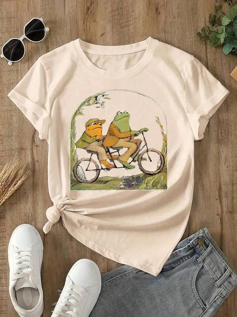 GiftGiftGiftGiftCamiseta de Cuello Redondo con Estampado de Rana de Dibujos Animados Vibrante - Tejido de Poliéster Suave con Microelasticidad, Largo Regular, Camiseta Casual de Manga Corta para Primavera y Verano, Ropa de Moda para Mujer con Estampado Posicionado. SuaveSuave - Albaricoque - Ver 1