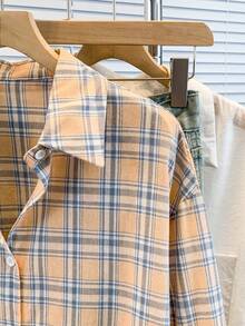 Áo sơ mi nữ dài tay kẻ caro xanh dương, chất liệu polyester, kiểu dáng thường ngày. - trái cam - Xem 6