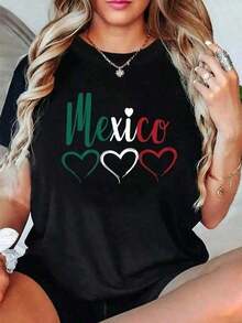 Under The RadarGraphic Print Camiseta Temática Mexicana para Mujer - Colores de la Bandera y Texto en Español con Diseño de Corazones, Sombrero e Insignia MEXICO, Poliéster Ligero Cuello Redondo Manica Corta, Ropa Casual Cómoda Todos los Tiempos del Año, Atuendo Cultural Mejicano Ide AD6Q-Vintage Street Style Unisex Loose Cotton Short Sleeve Crew Neck T-Shirt - Negro - Ver 1