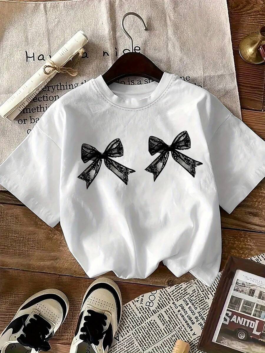 Camiseta Blanca Oversize para Mujer con Estampado - Manga Corta, Cuello Redondo, Estilo Casual, Ajuste Holgado para Todas las Temporadas, Ideal para Ropa Informal, Fiestas y Deportes| Tallas S-3XL|Diseño minimalista, prenda versátil para combinar (lavable a máquina) - Camiseta elegante de manga corta con cuello redondo y estampado de lazos aleatorios, corte holgado para salidas casuales, citas y eventos festivos, adecuada para hombres y mujeres, camisetas para mujer, camiseta oversize, camisetas de manga larga para hombre, camiseta para mujer Y2k, camiseta, camisa. - Negro - Ver 1