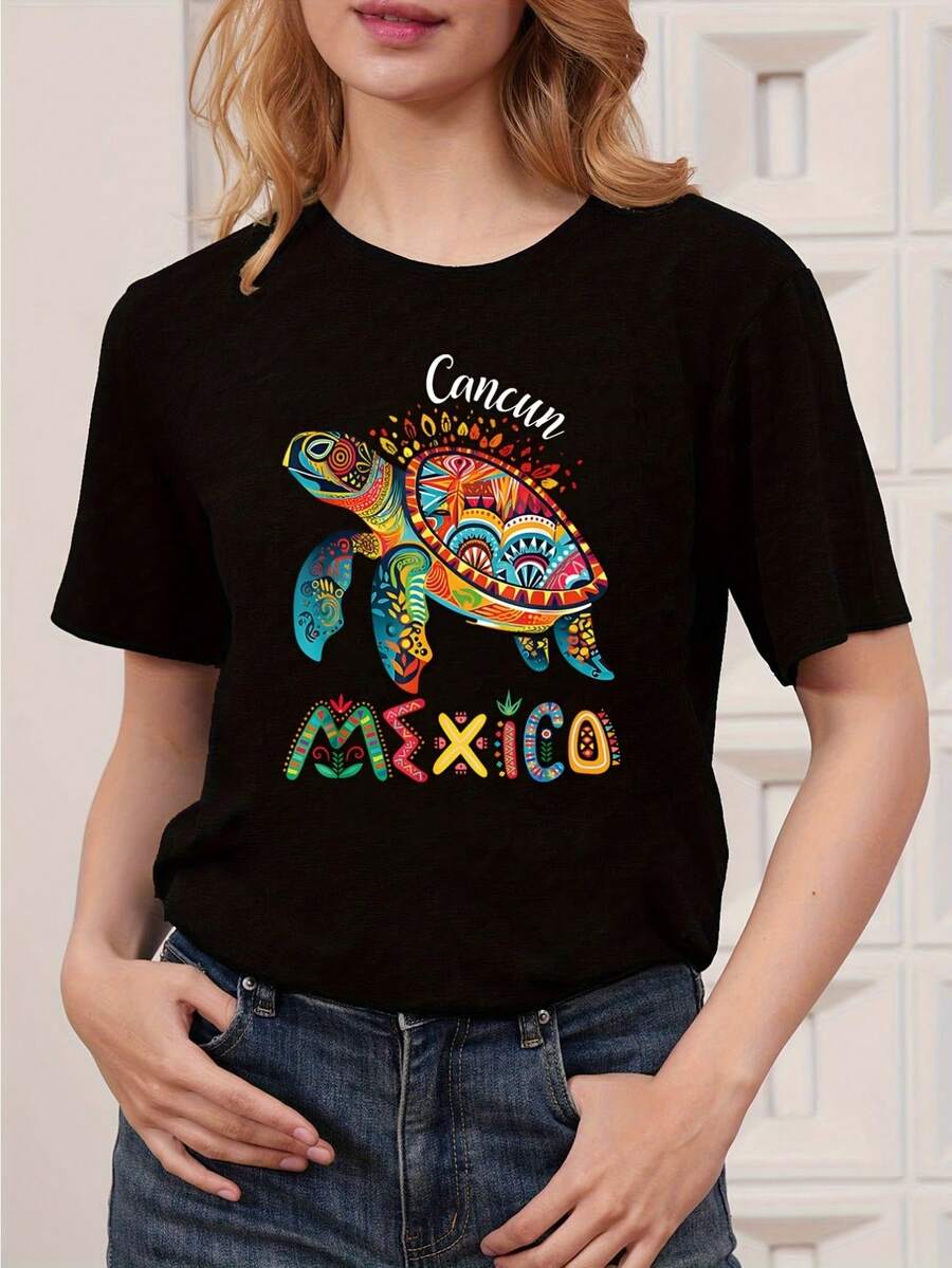 Camiseta Gráfica de Cancún, México, para Mujer y Unisex - Estampado de Tortuga con Flores Mexicanas Coloridas y Letras de Cancún - Camiseta de Manga Corta con Cuello Redondo, Suave y Transpirable - Camiseta Ligera para Vacaciones de Verano, Playa, Viajes, Ropa Casual - Cultura Mexicana - Negro - Ver 1