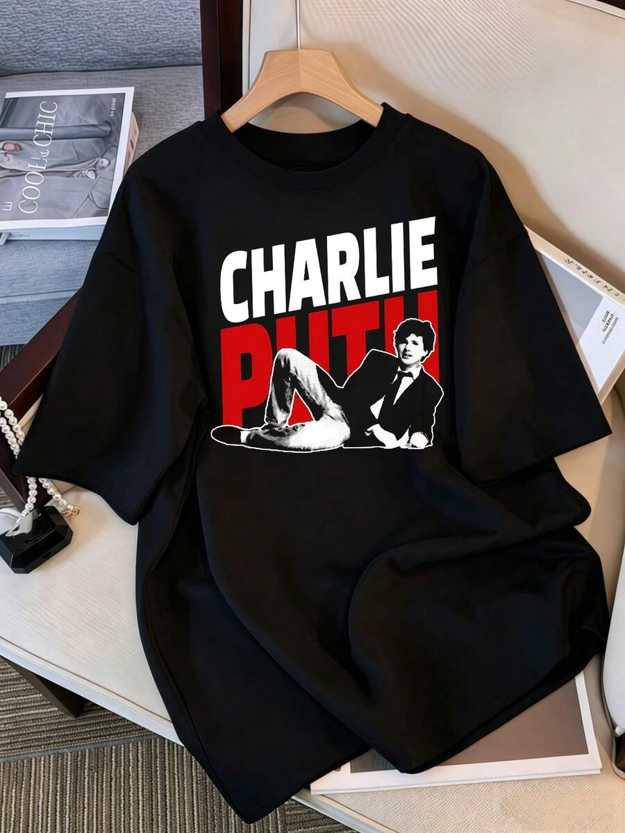 2026 T-Shirt, Charlie Puth Red And White Portrait Graphic T-Shirt, Oversized Casual T-Shirt For Pop Fans, Retro Bootleg Style K-Pop Idol Oversized T-Shirt, Vintage Graphic Print T-Shirt, Short Sleeve Casual Top, K-Pop Fan Merchandise, Black Streetwear T-Shirt For Fans, Vintage K-Pop Star Graphic T-Shirt, Short Sleeve Oversized T-Shirt With Retro Letter Print, Black Casual Crew Neck Top, Streetwear Style Idol Fan Gift, Comfortable Loose Fit Cotton Blend T-Shirt For Women And Men. - Black - View 1